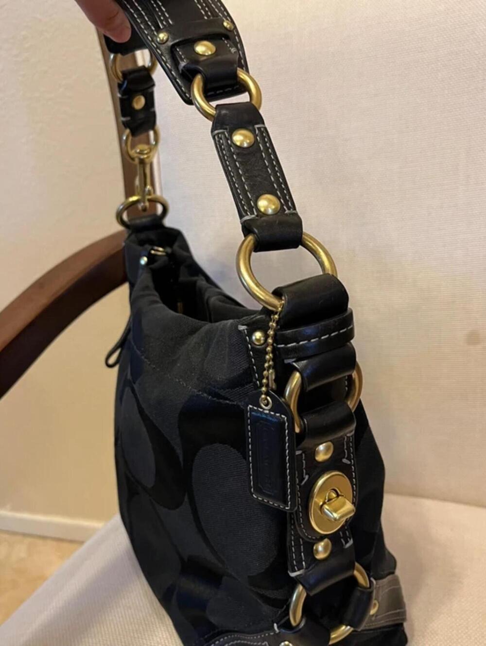 Coach Carly black signature canvas hobo bag in golf hardware
